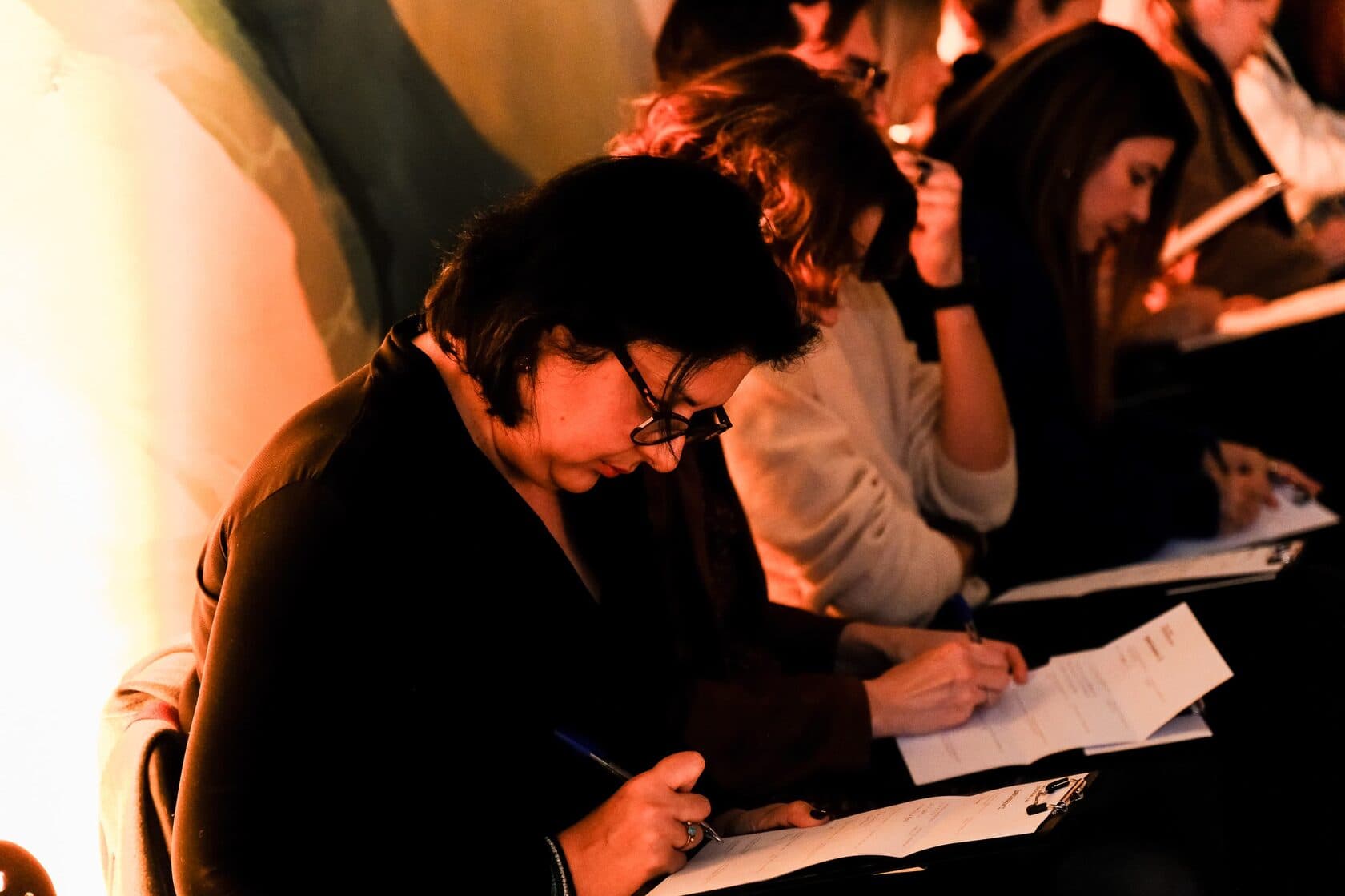 Participants writing questionnaires